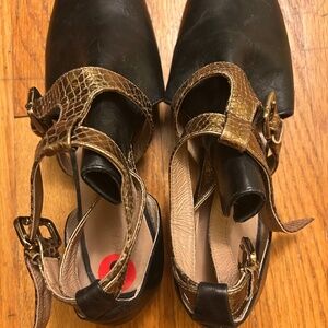 Dark brown leather booties, open sided  with textured bronze straps